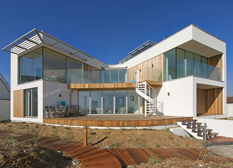 Seaside property frontage with Ambient Lounge bean bags in living room area